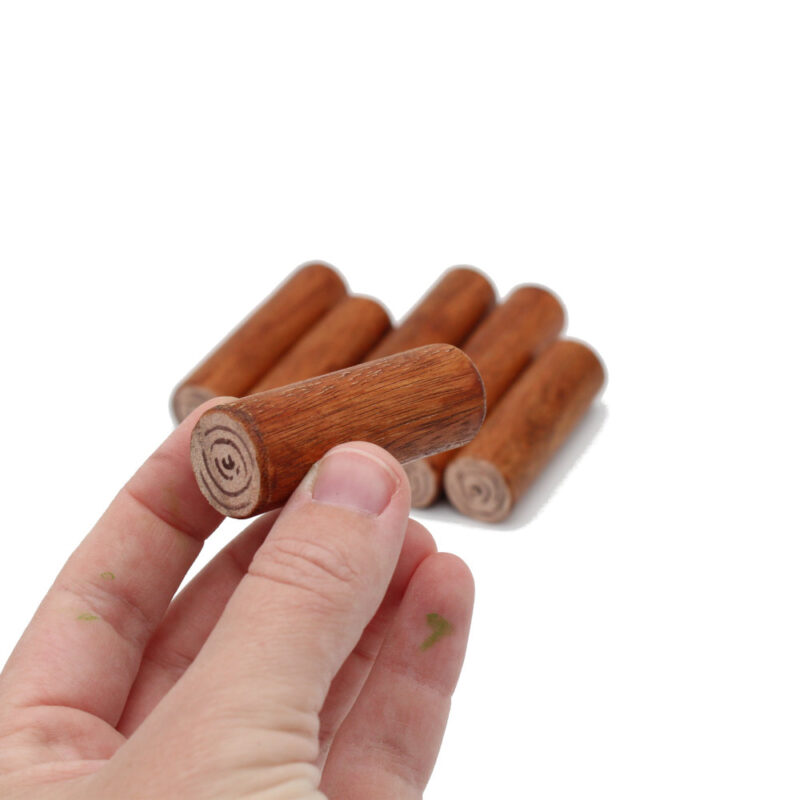 Log Pile Wooden Figures in hand